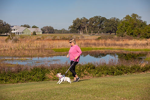 women and dog in a park